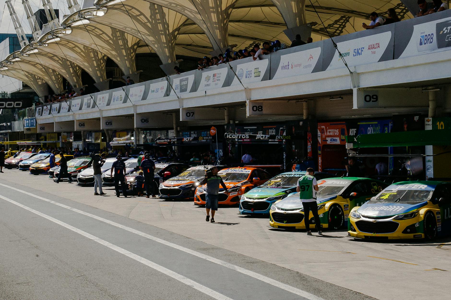 view of race cars parked in the garages